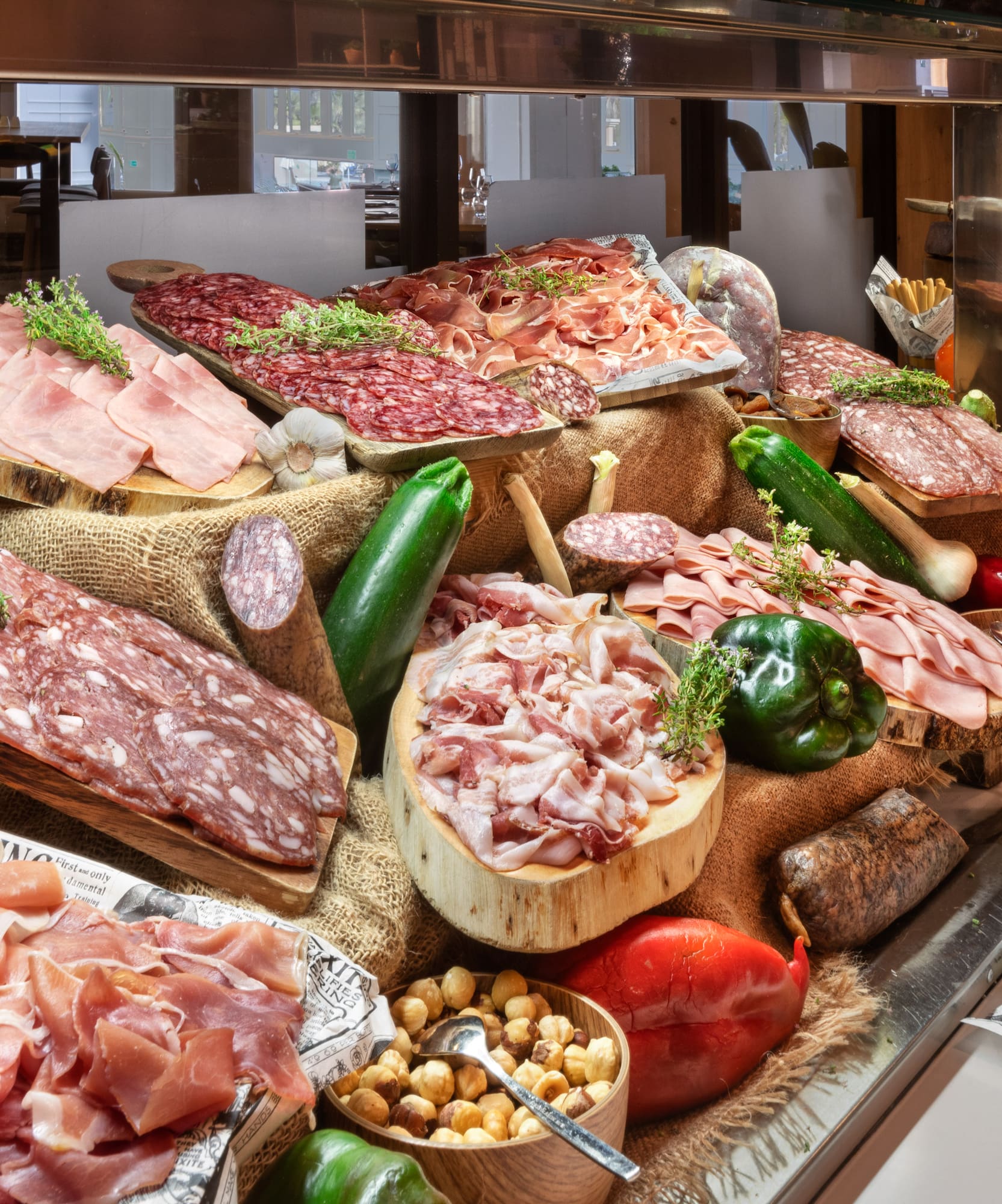 a display of meats and vegetables