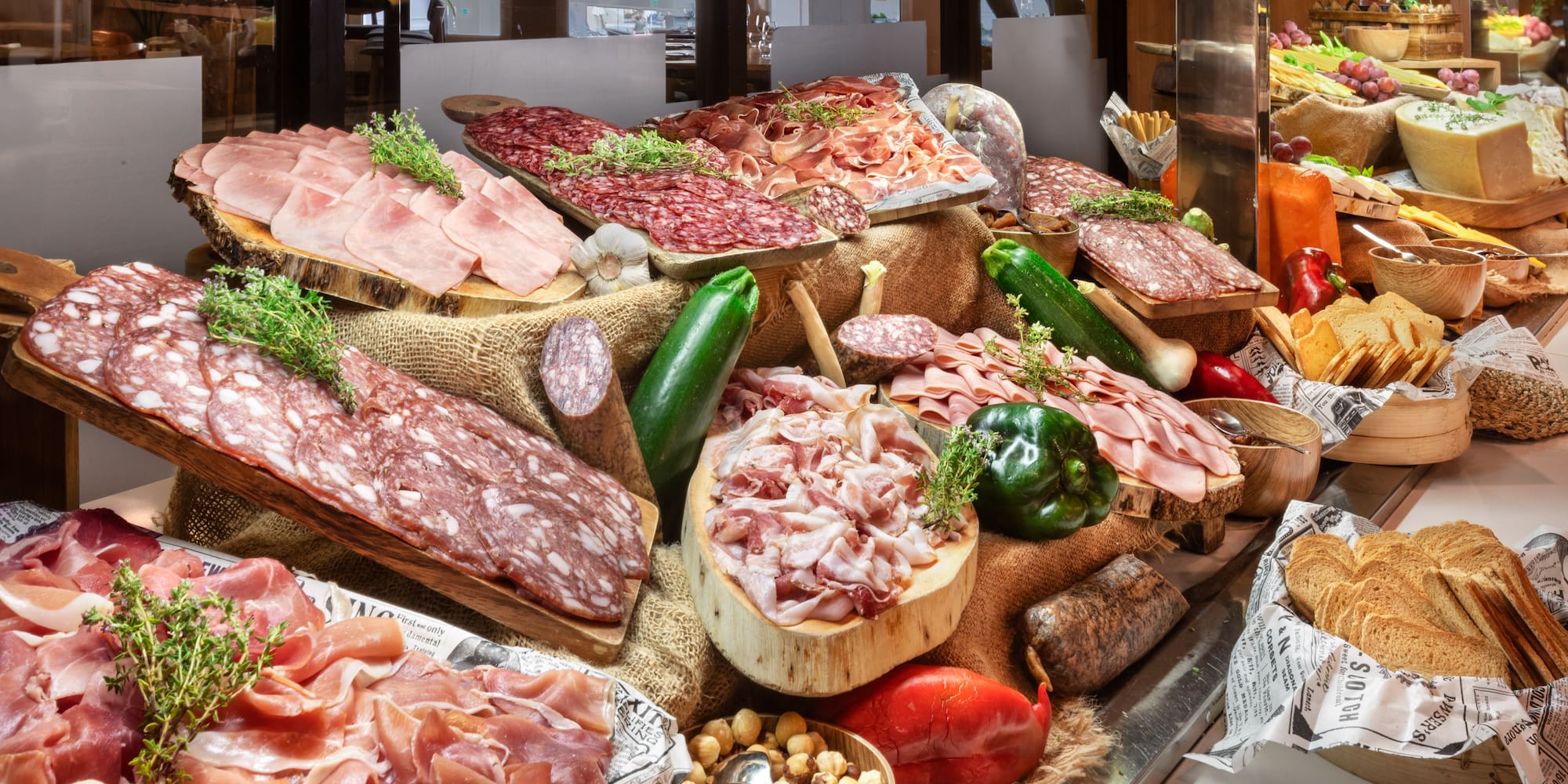 a display of meats and vegetables