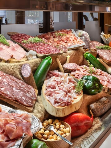 a display of meats and vegetables