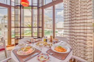 a table with plates of food and glasses on it