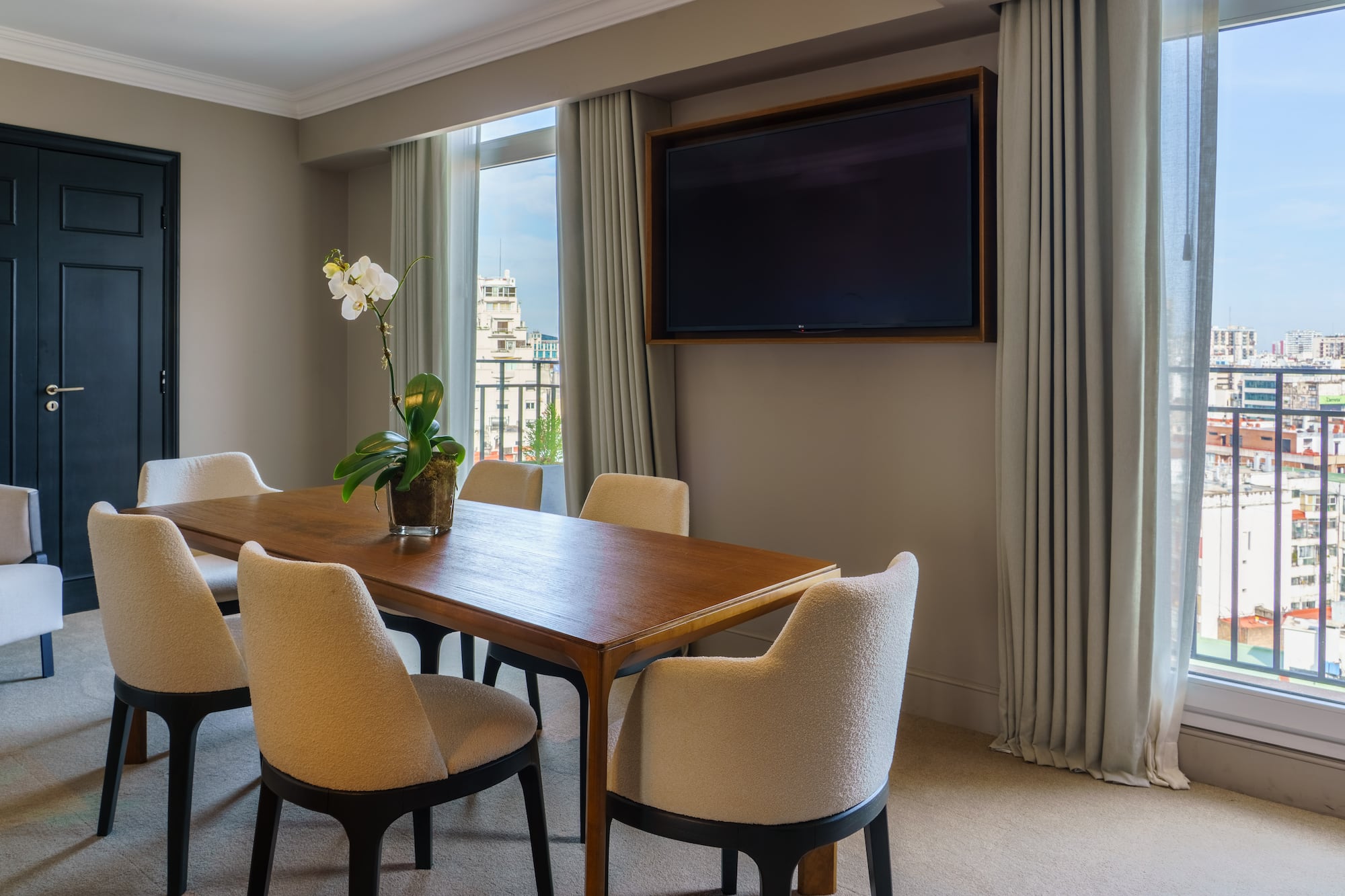 a room with a table and chairs