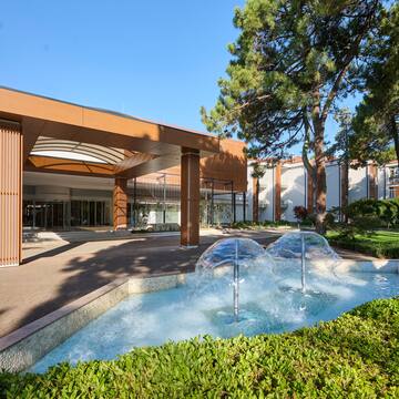 a water fountain in front of a building