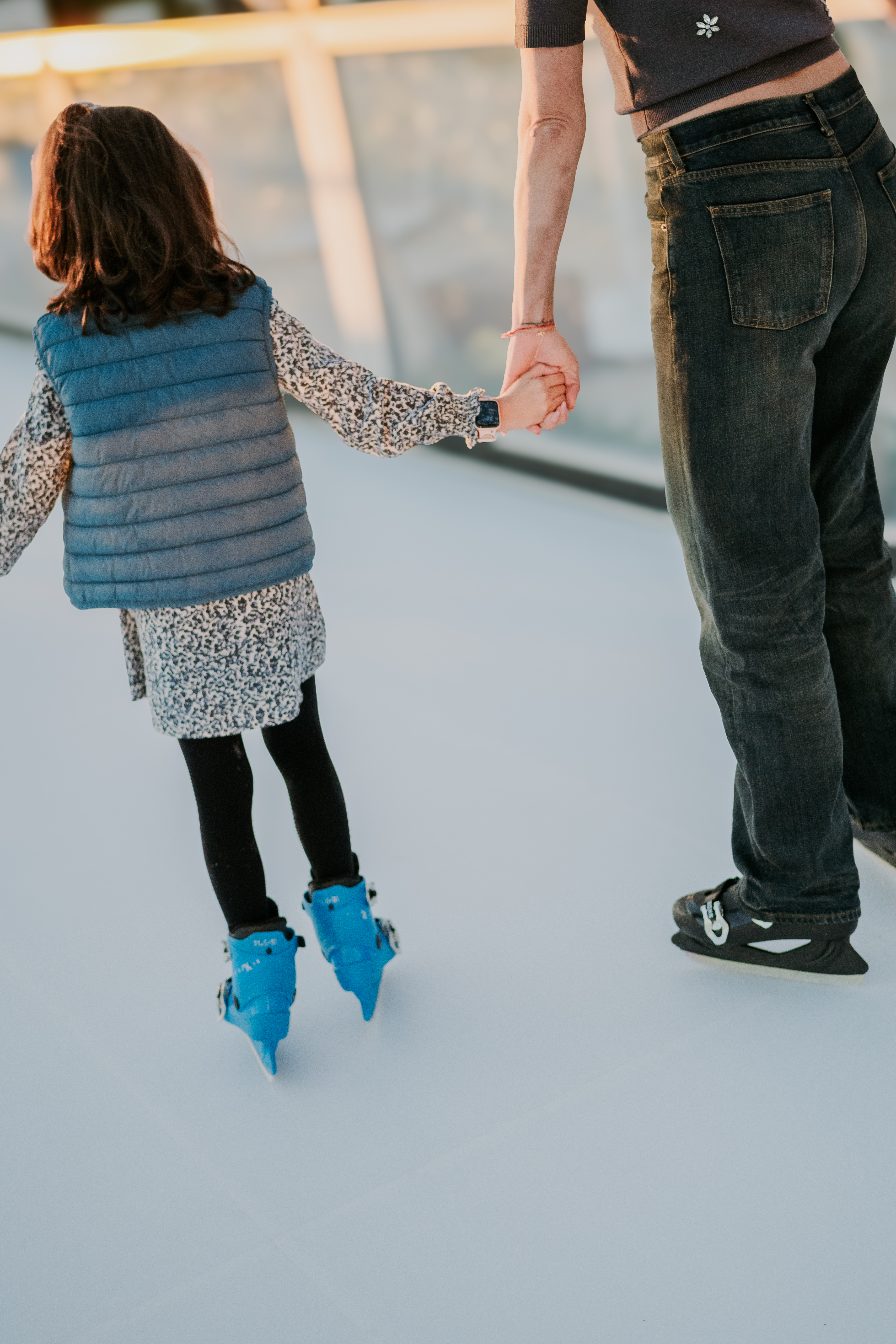 a man and a girl holding hands