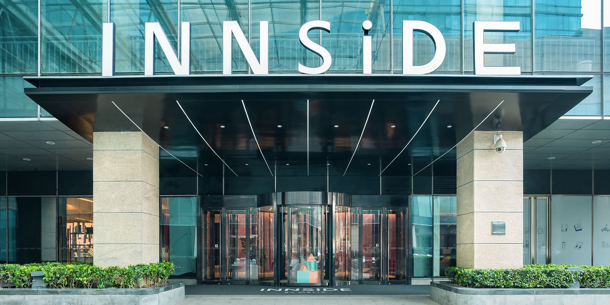 a building with glass doors and a sign