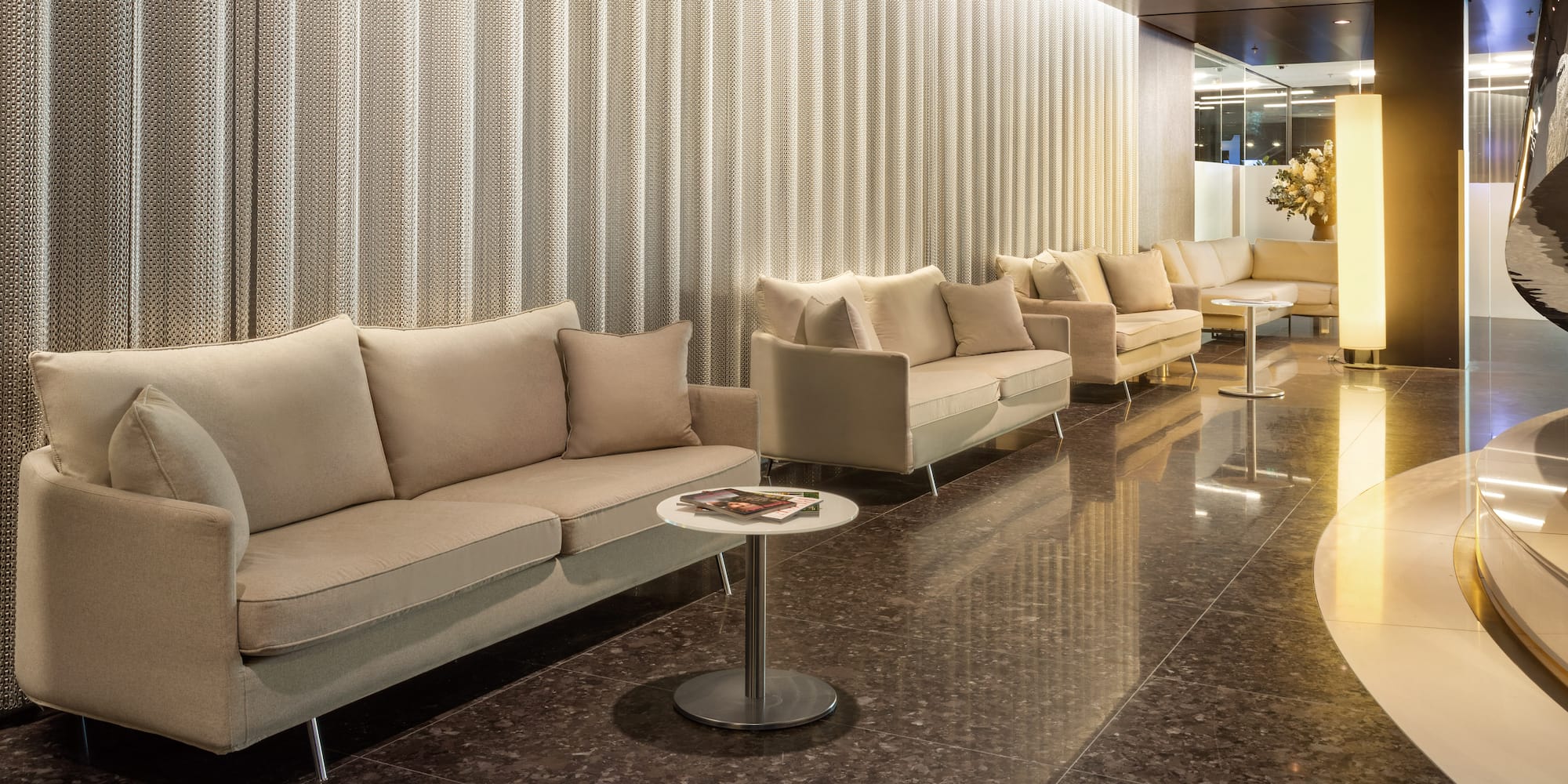 a room with couches and tables