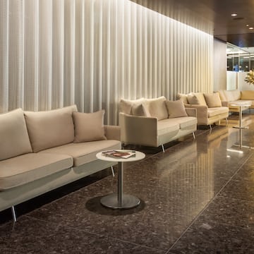 a room with couches and tables