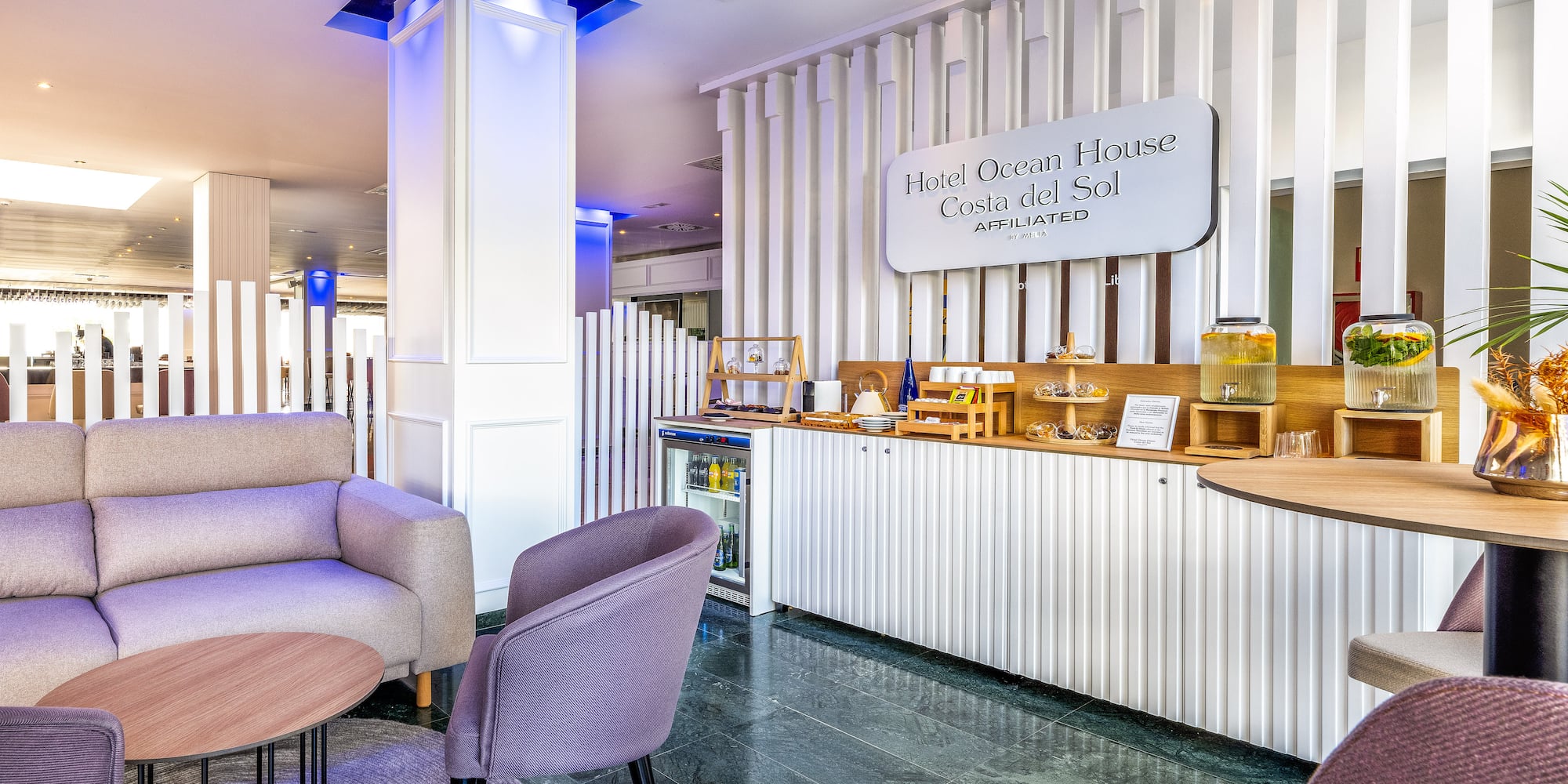 a room with a bar and chairs