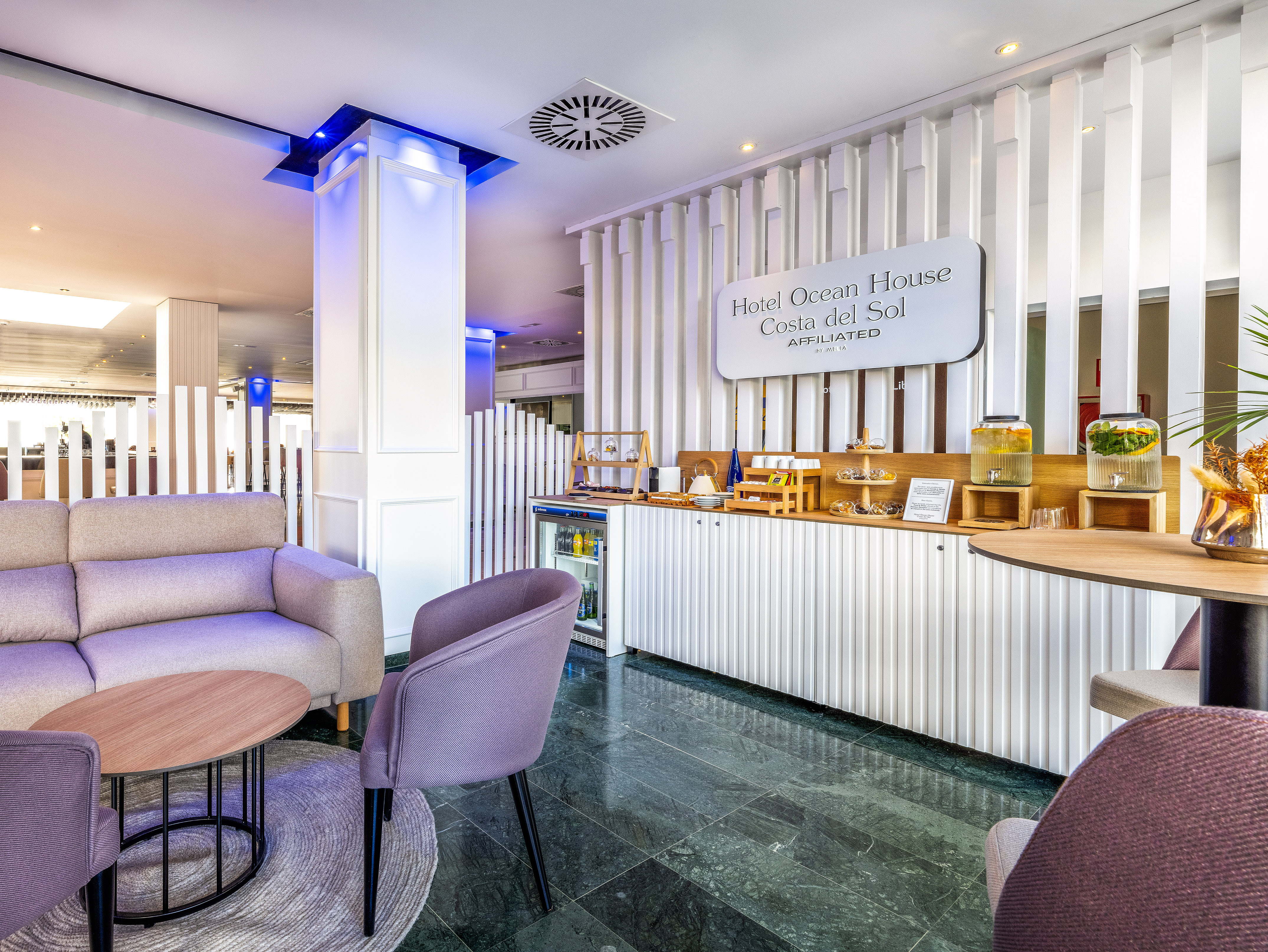 a room with a bar and chairs