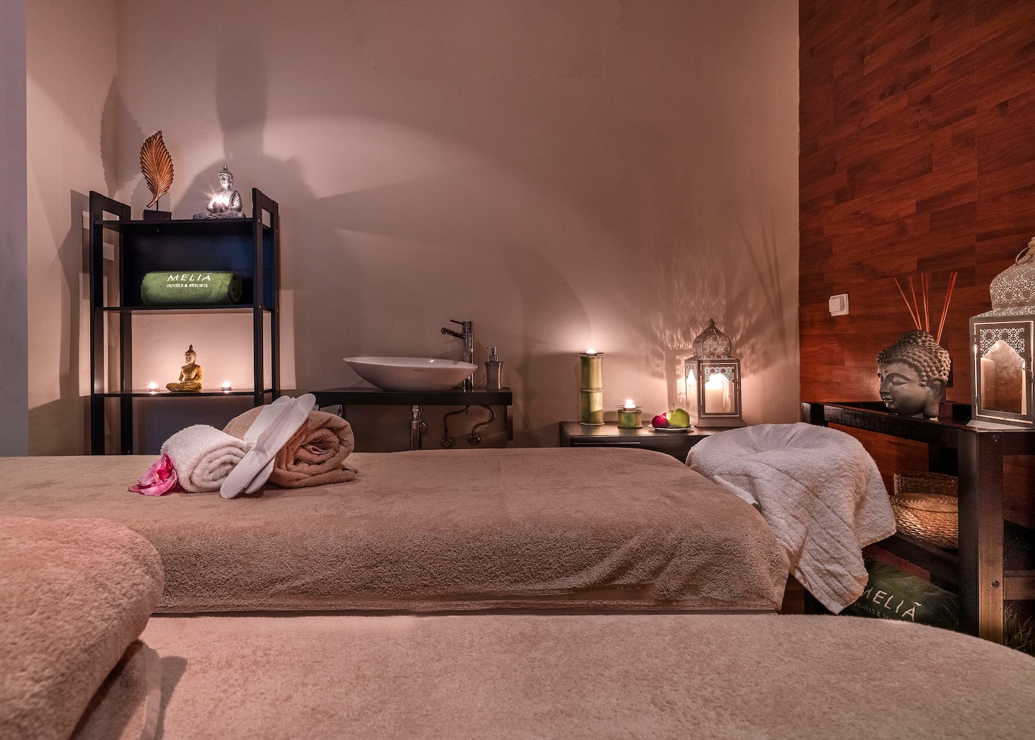 a room with a bed and towels