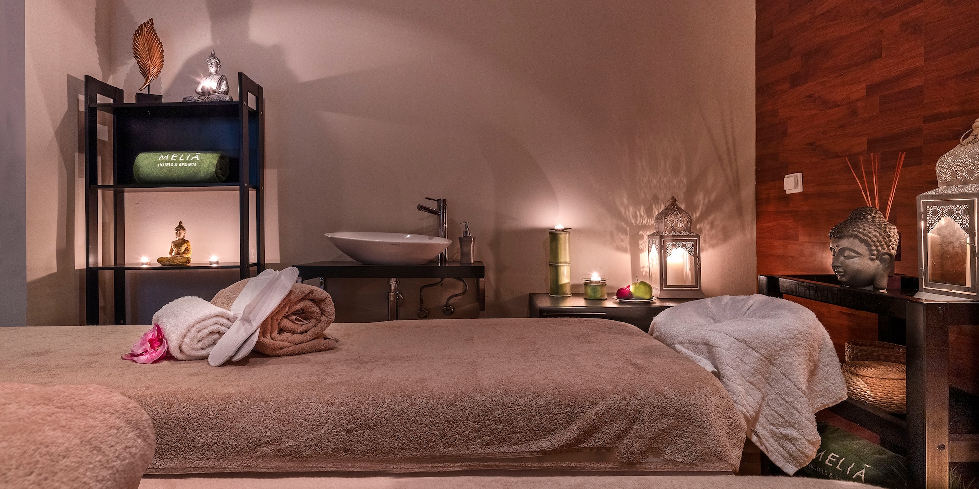 a room with a bed and towels