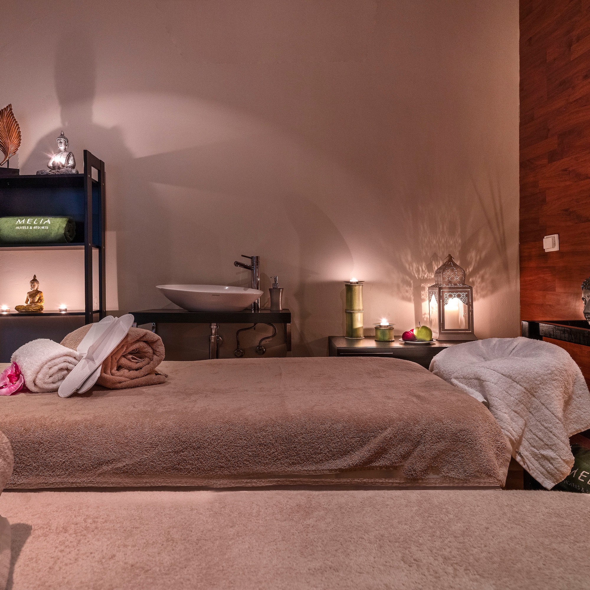 a room with a bed and towels