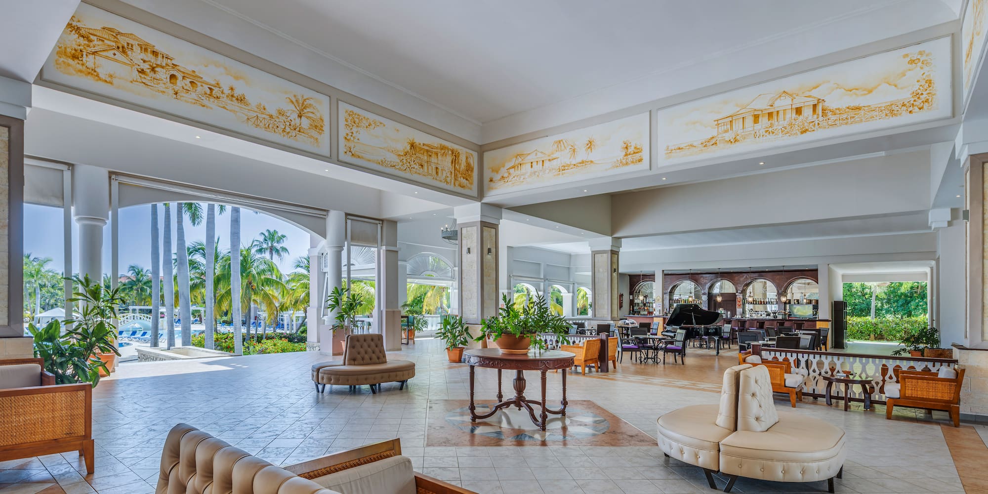 a large room with a piano and couches