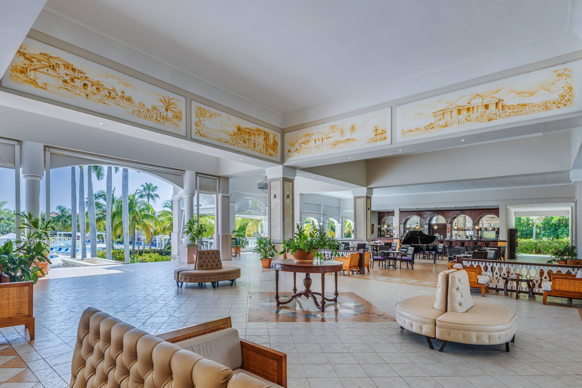 a large room with a piano and couches