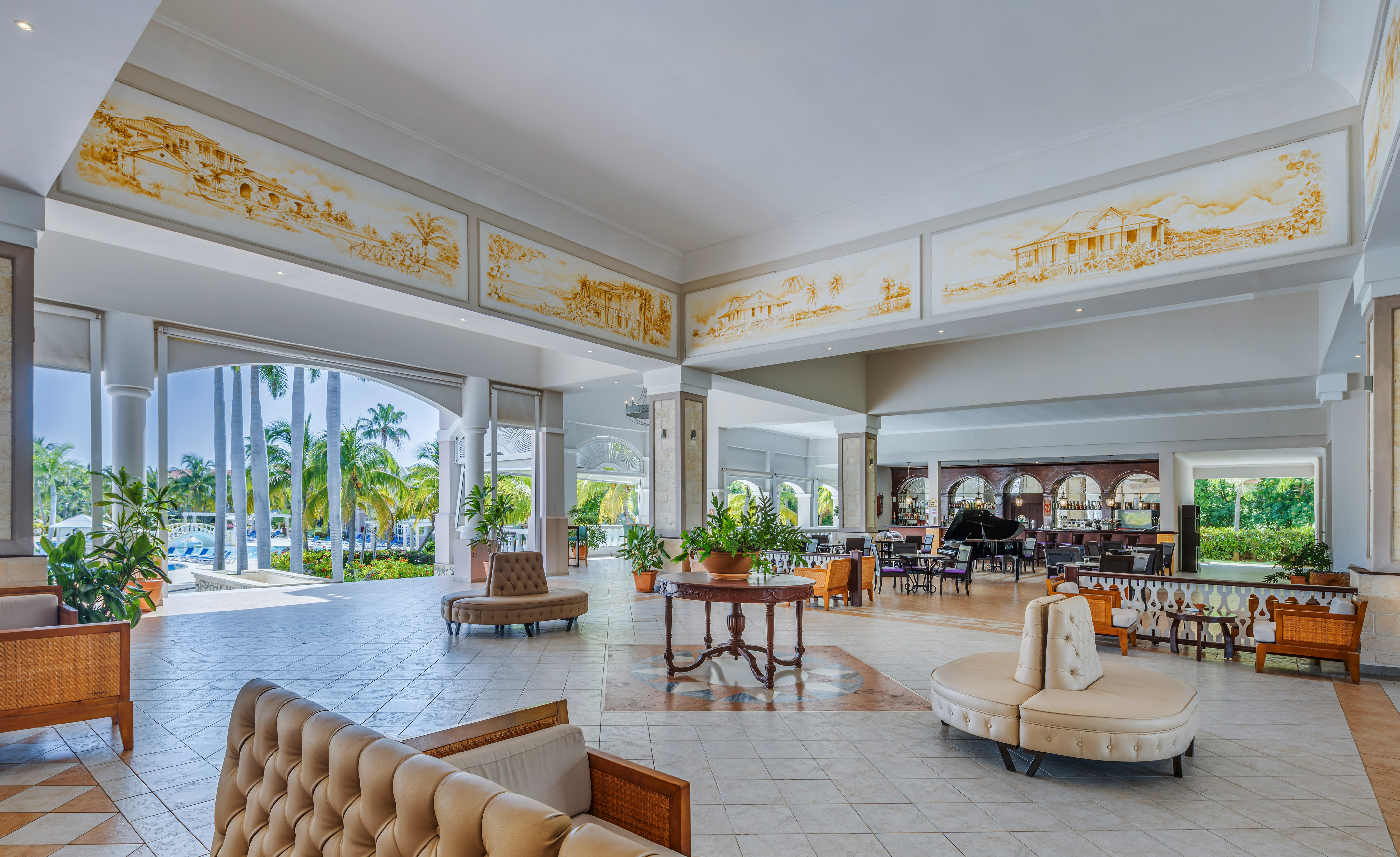 a large room with a piano and couches