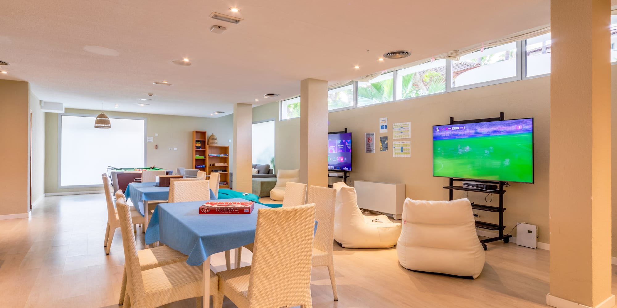 a room with a television and tables