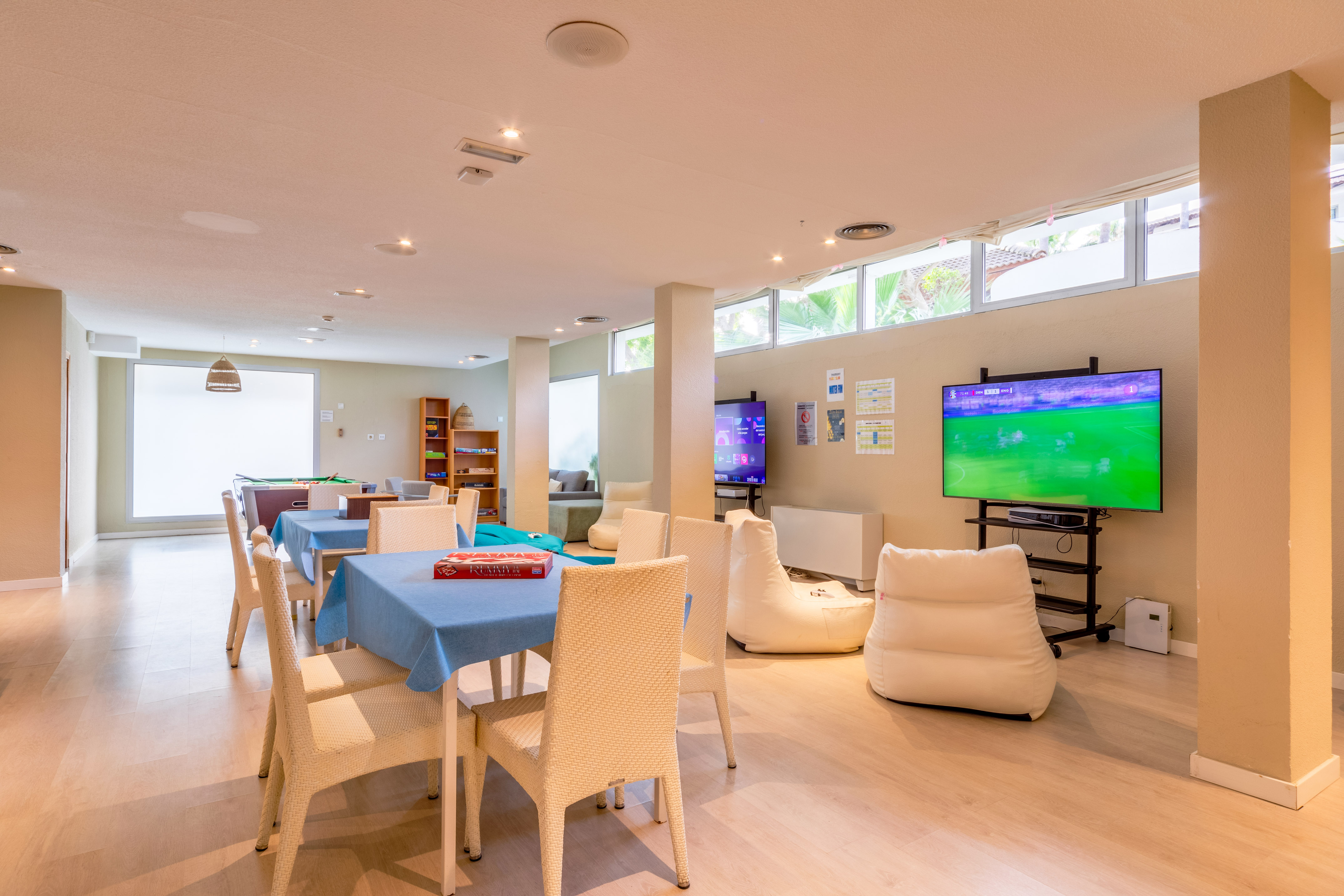 a room with a television and tables