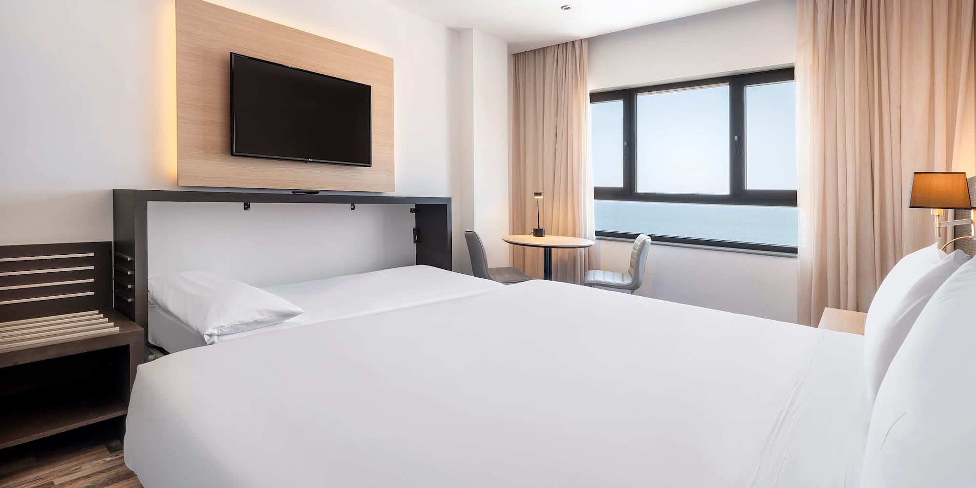 a room with a bed and a tv