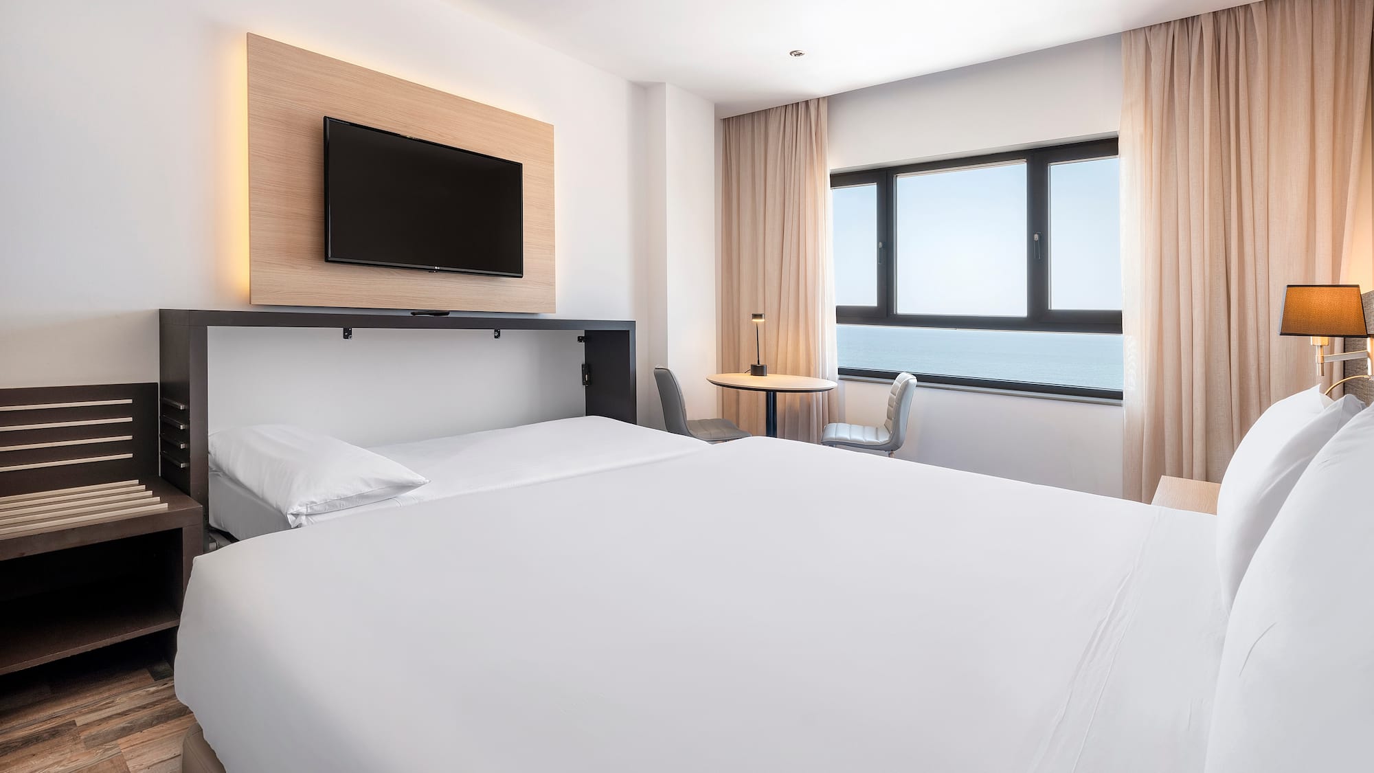 a room with a bed and a tv