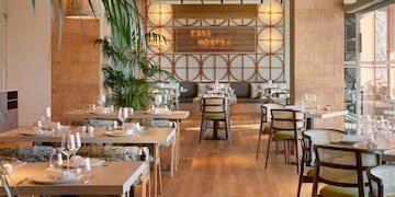 a restaurant with tables and chairs