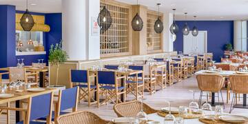 a restaurant with tables and chairs