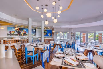 a restaurant with tables and chairs