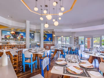 a restaurant with tables and chairs