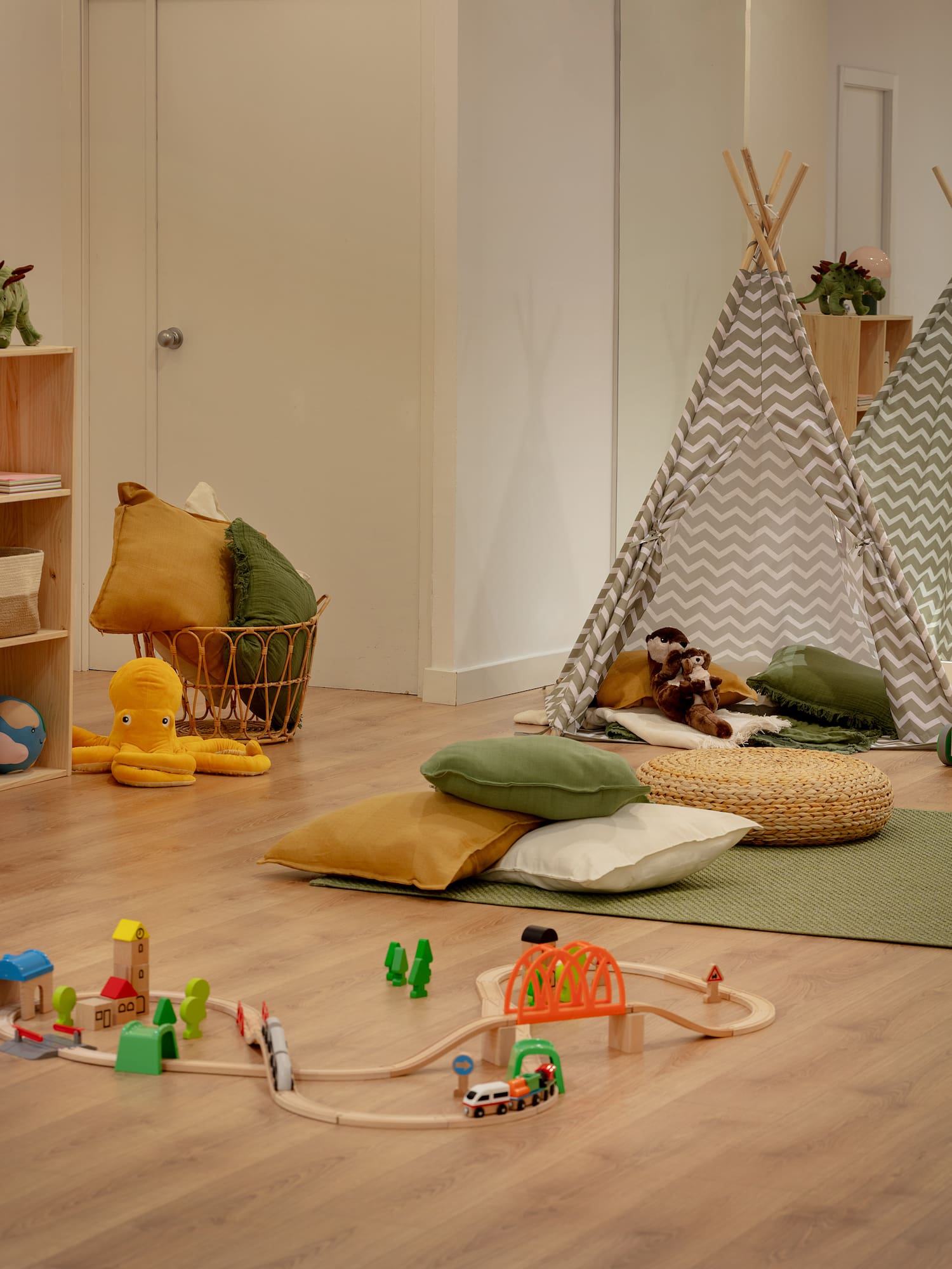a room with a playroom with toys