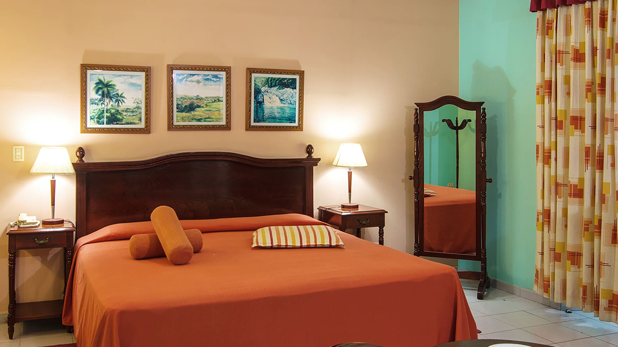 a bedroom with a bed and a mirror