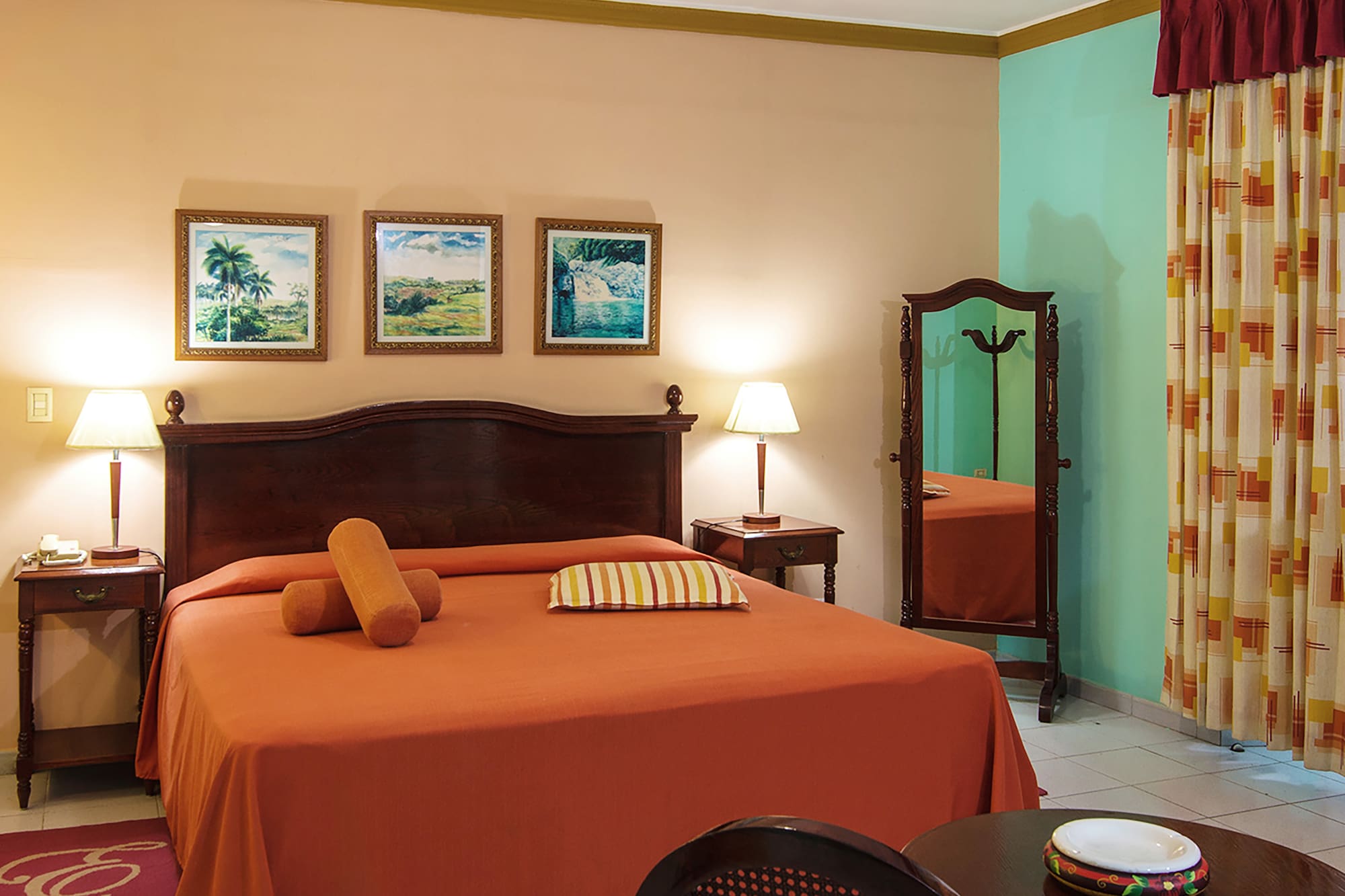 a bedroom with a bed and a mirror