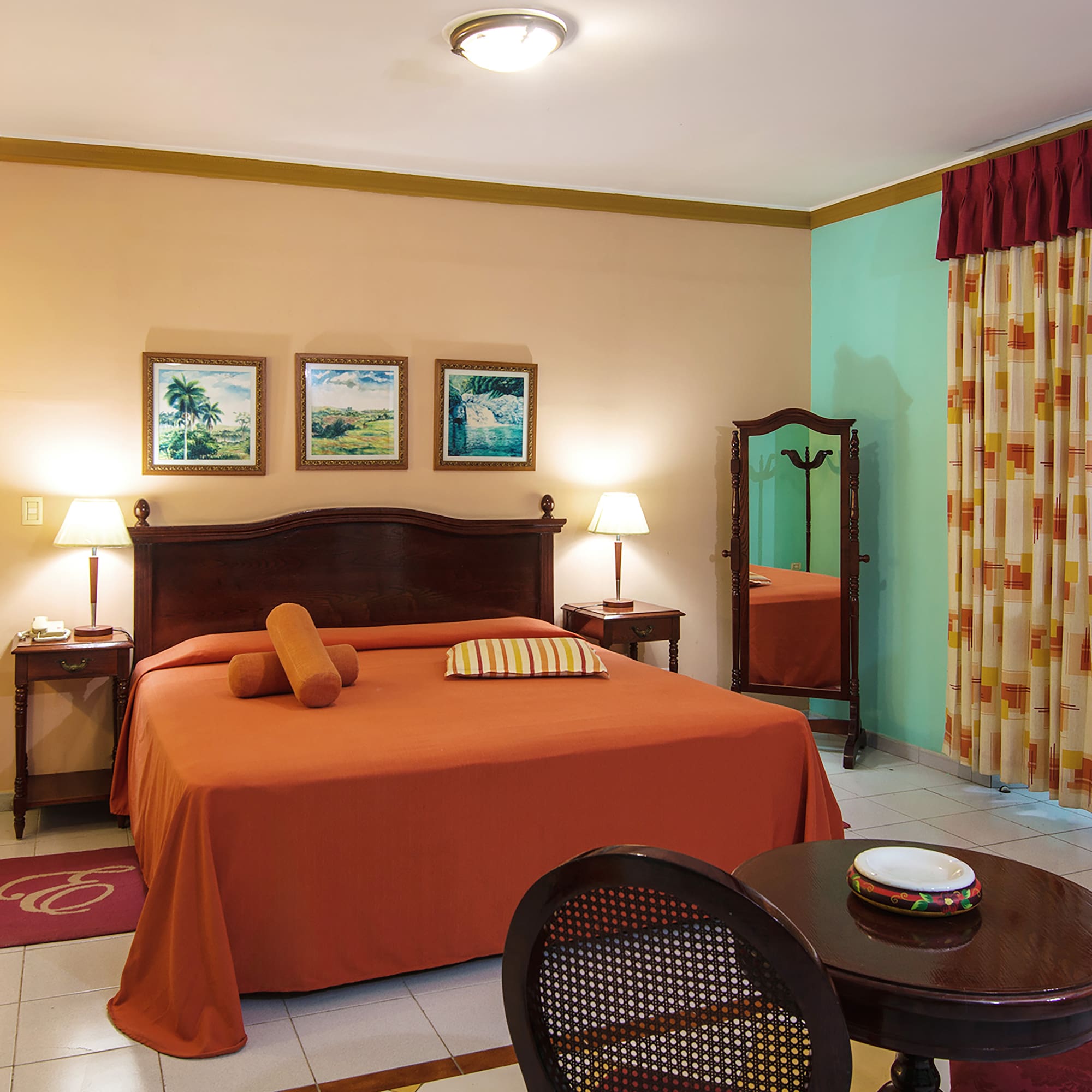 a bedroom with a bed and a mirror