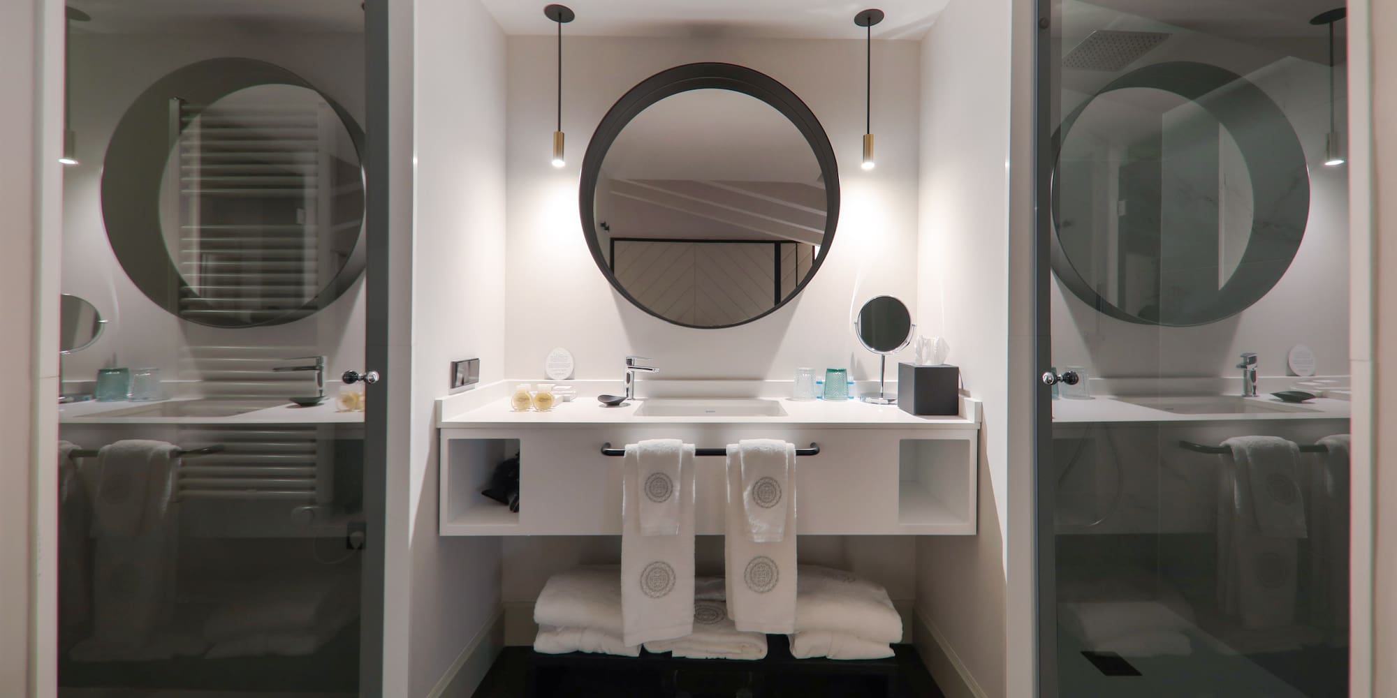 a bathroom with a mirror and a sink
