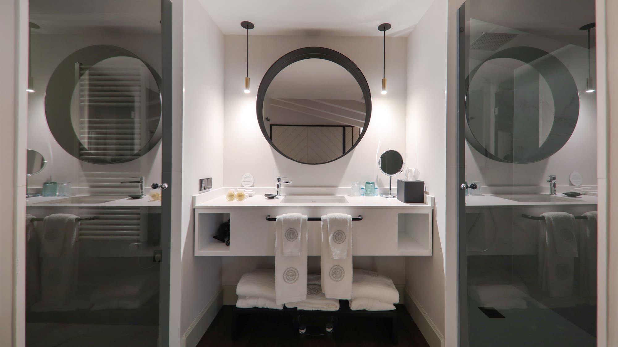 a bathroom with a mirror and a sink