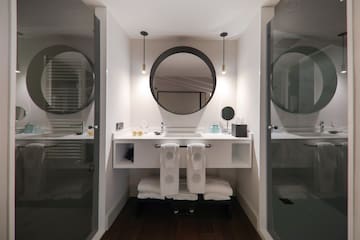 a bathroom with a mirror and a sink