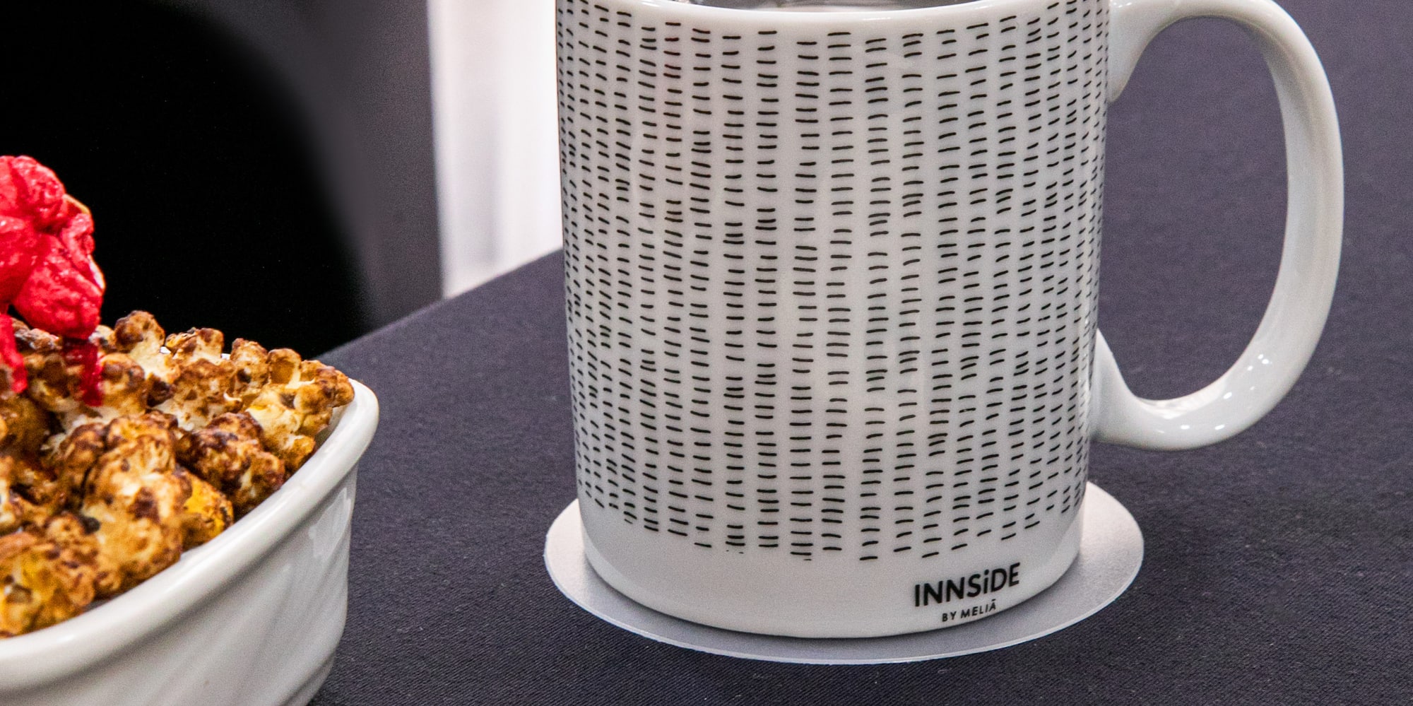 a cup of coffee and a bowl of popcorn