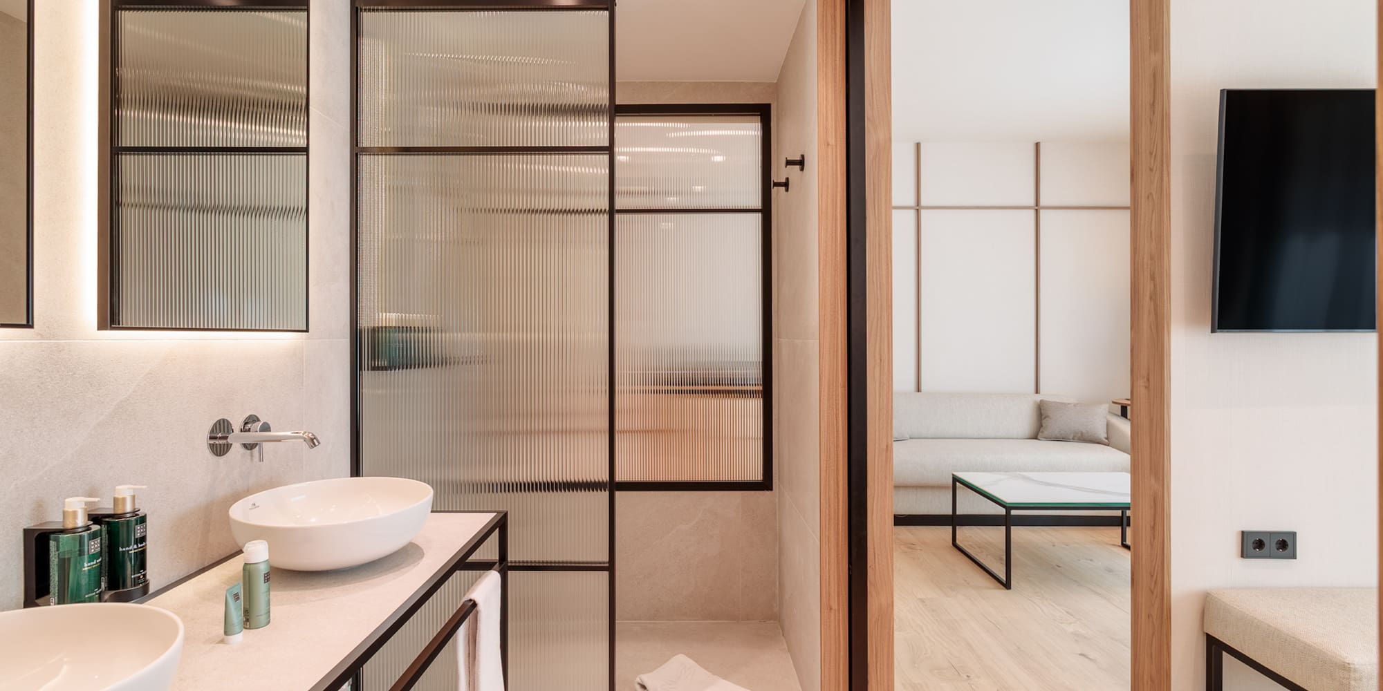 a bathroom with a glass shower door