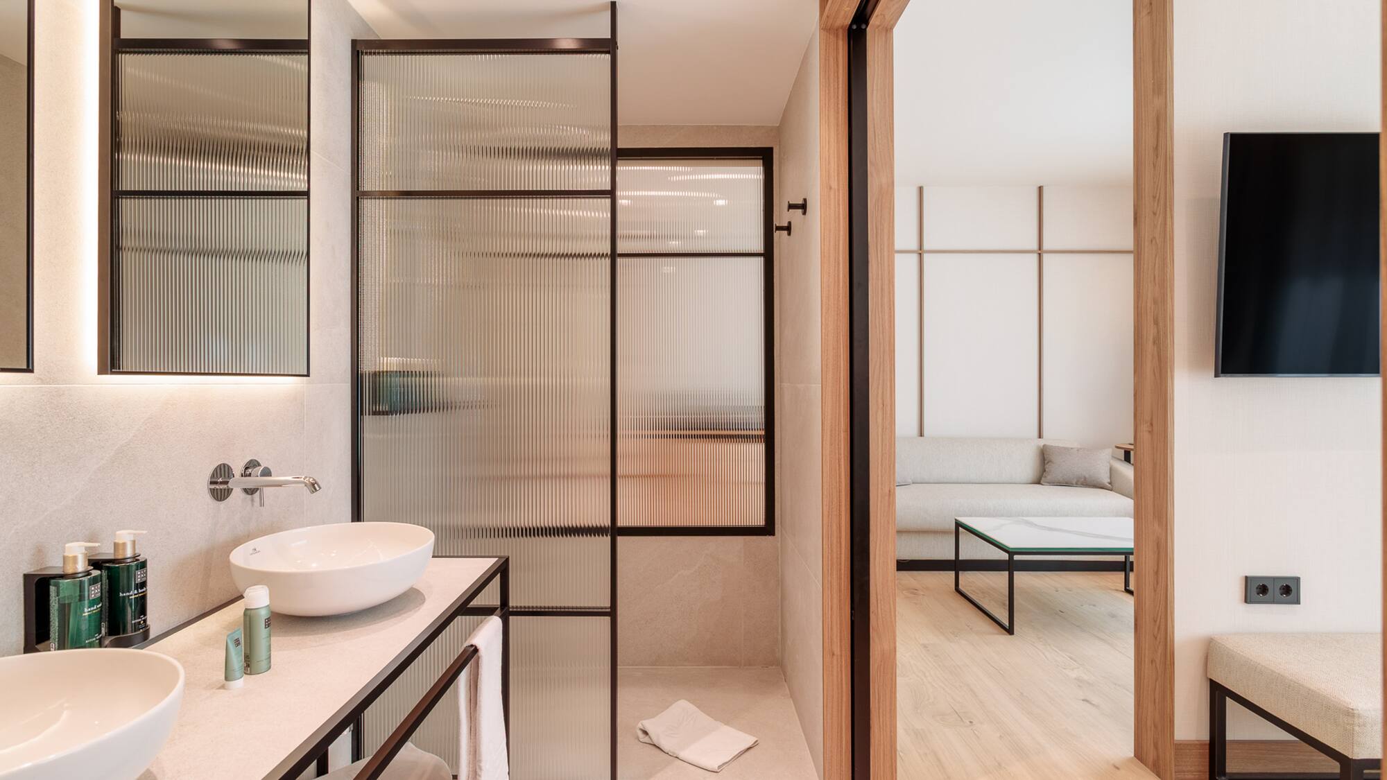 a bathroom with a glass shower door