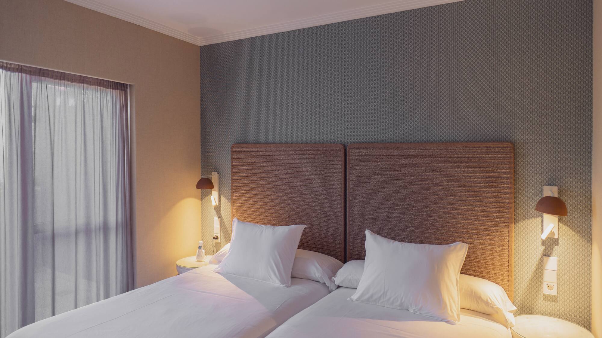 a two beds in a room