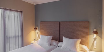 a two beds in a room