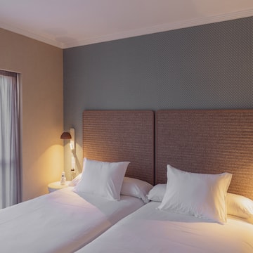 a two beds in a room