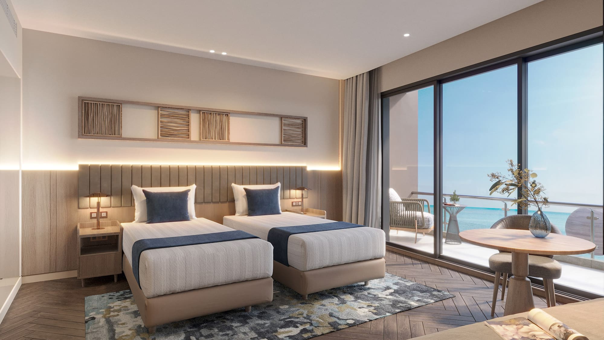 a room with two beds and a table and chairs