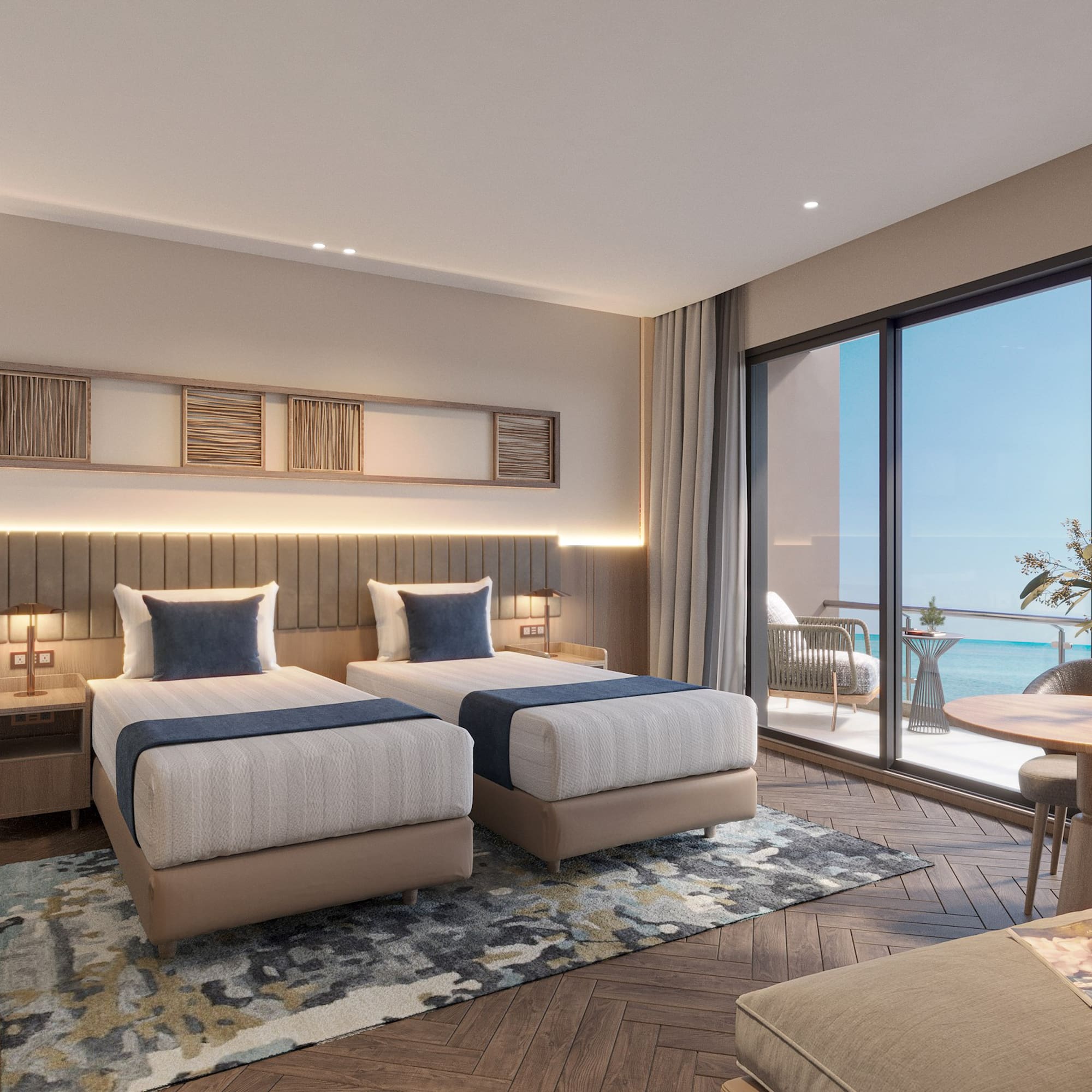 a room with two beds and a table and chairs