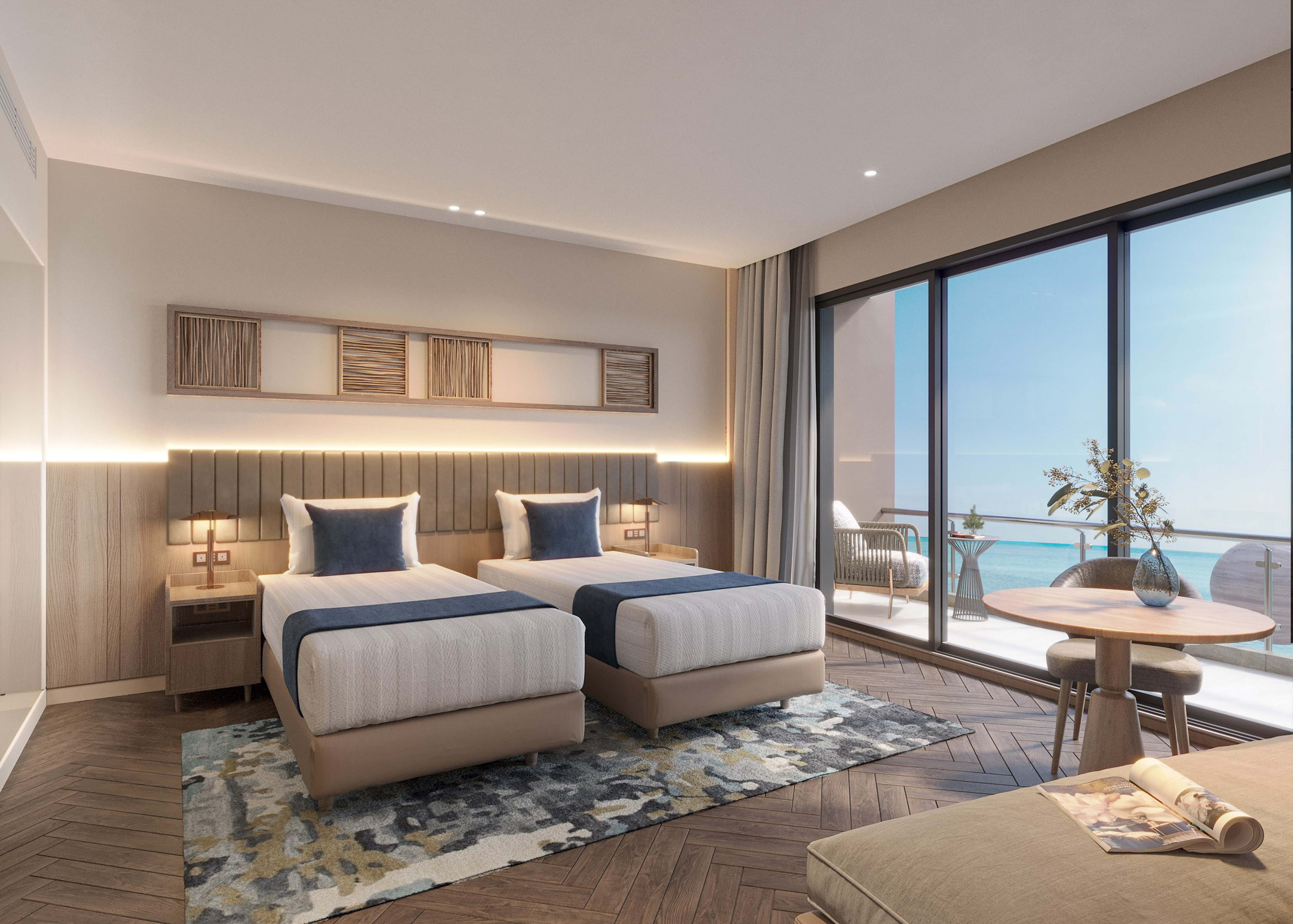 a room with two beds and a table and chairs