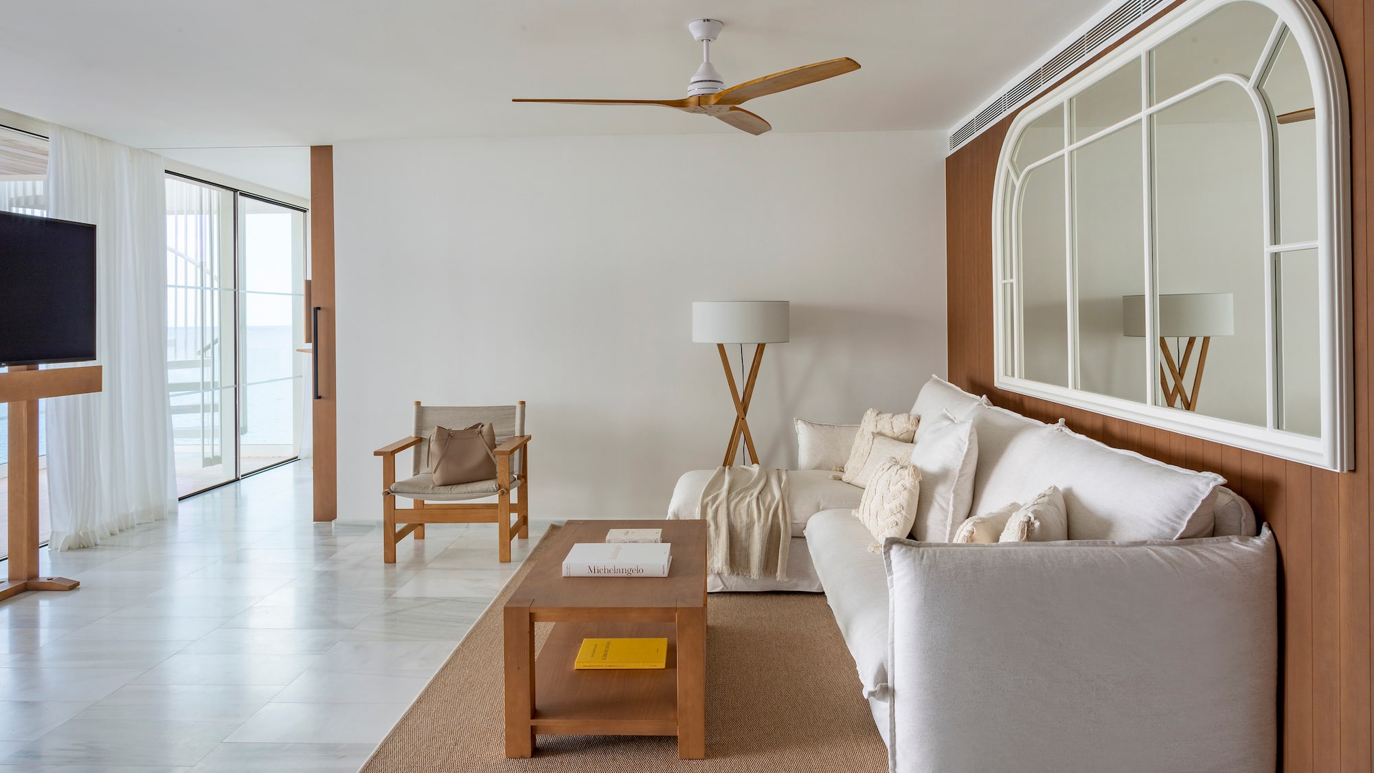 a living room with a white couch and a table