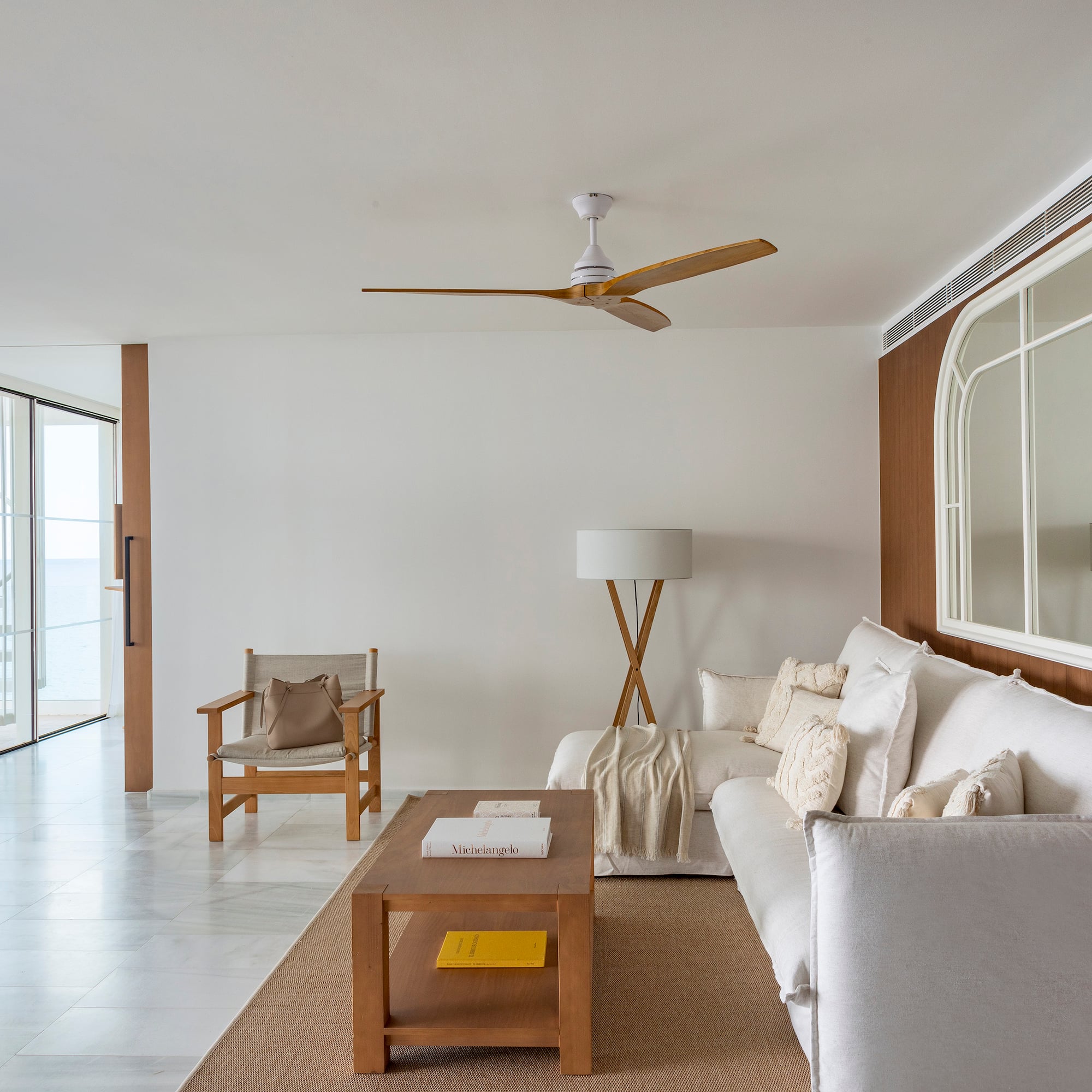 a living room with a white couch and a table