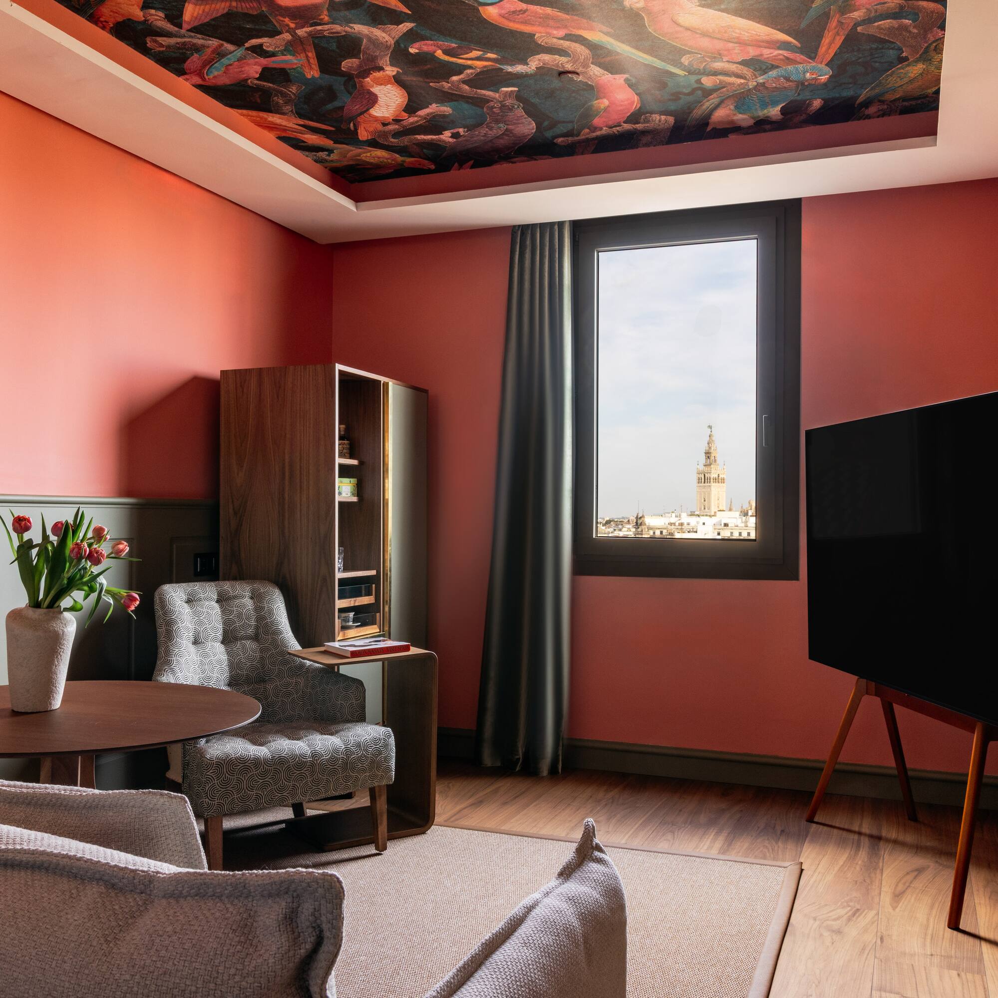 a living room with a tv and couches