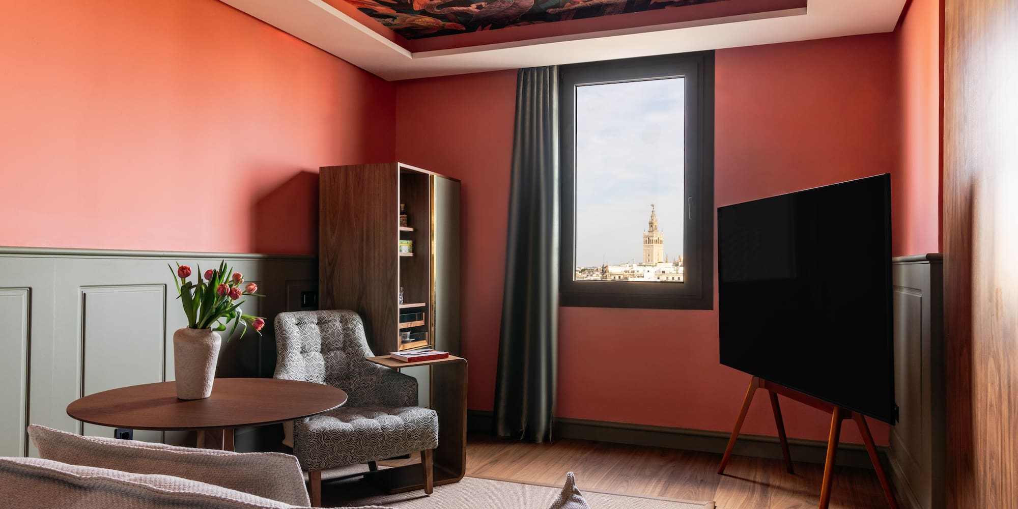 a living room with a tv and couches