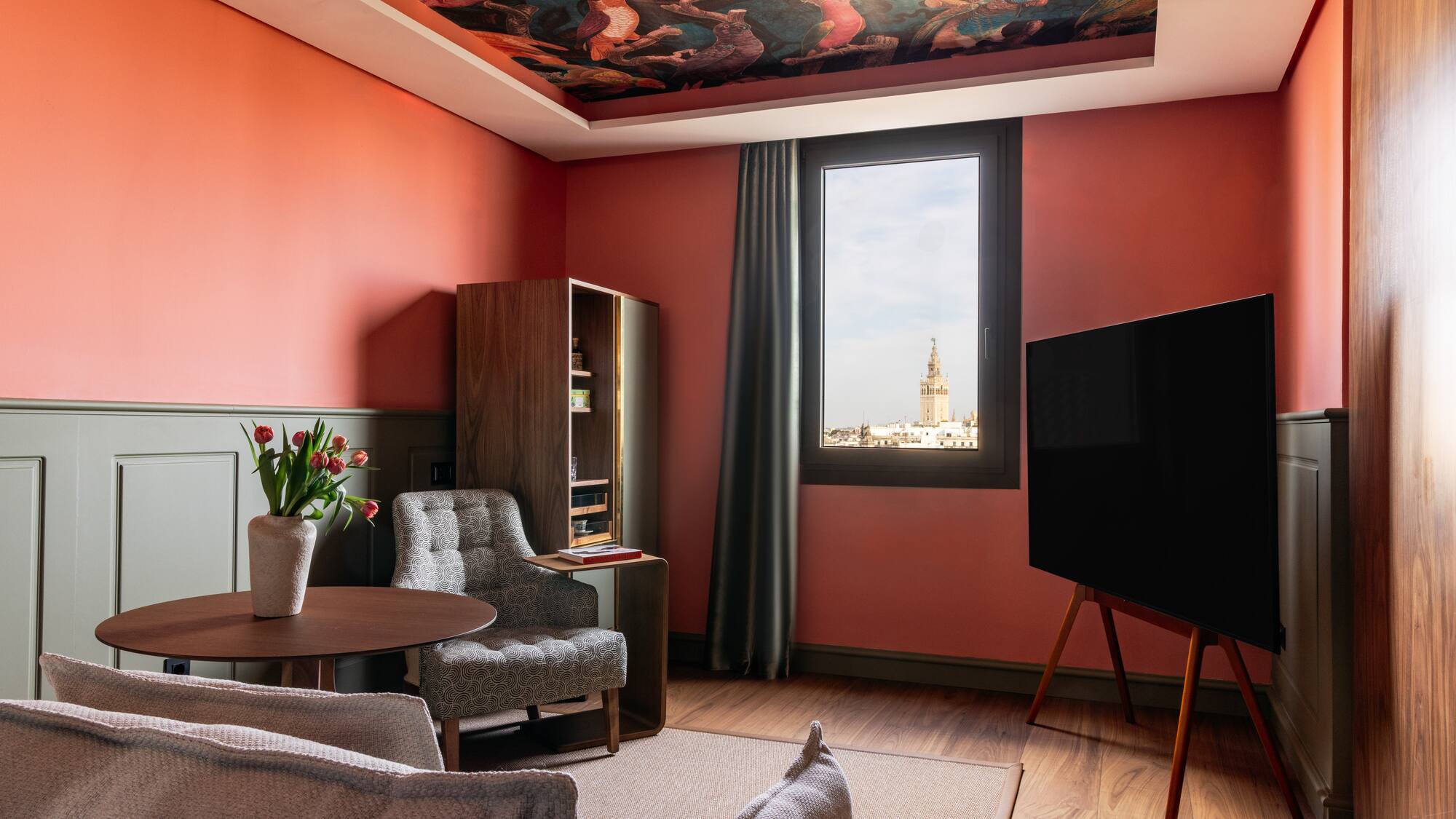 a living room with a tv and couches