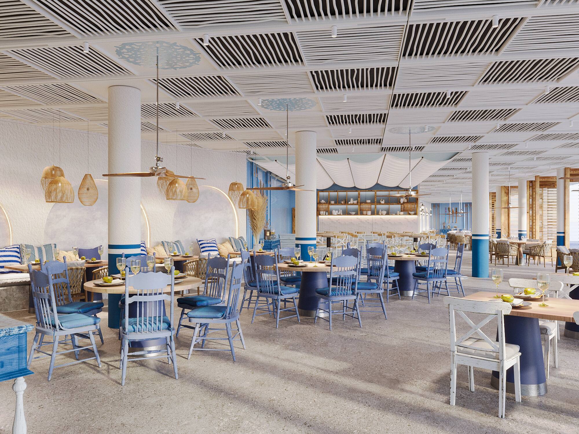 Bright Mediterranean dining room with blue chairs and white coastal decor.