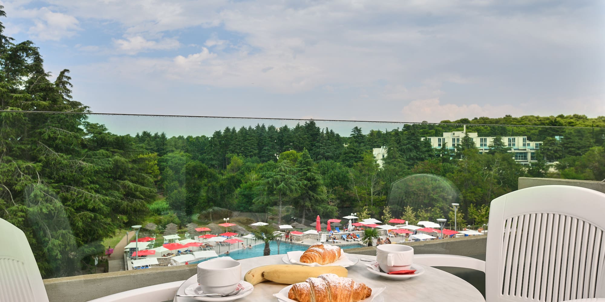 a table with food on it and a cup of coffee on it