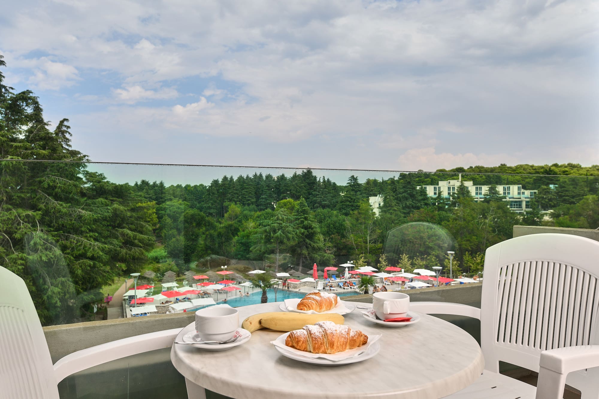 a table with food on it and a cup of coffee on it